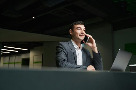 Phone conversation of business official on smartphone